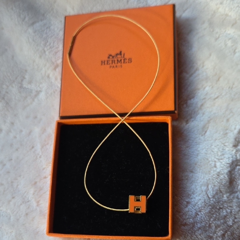 Hermes Gold Tone H Pendant Necklace with Orange Accent